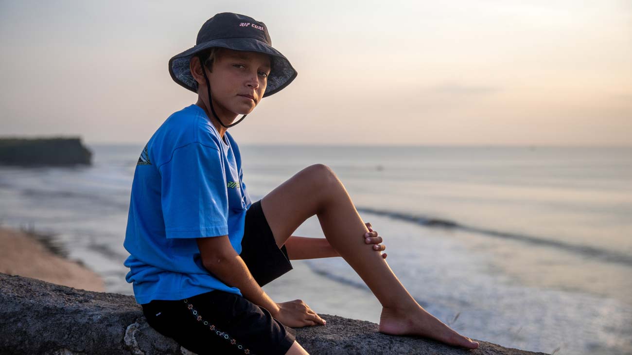 Close up portrait of Grom in Bali wearing the Rip Curl bucket hat