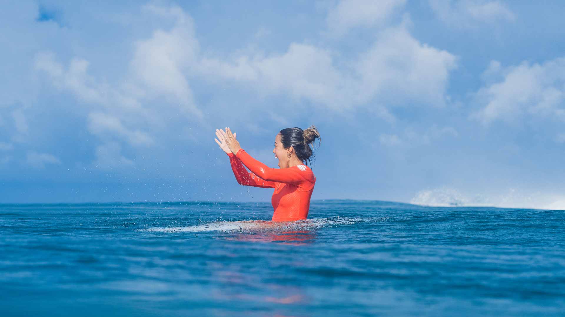 Rip Curl woman cheering on friends throughout their surf