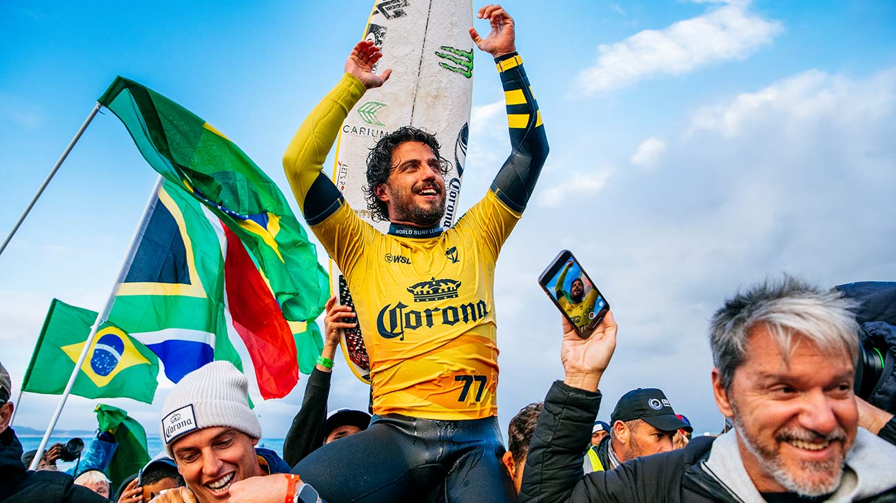 Filipe Toldeo being chaired up the beach after his win at J-Bay, South Africa