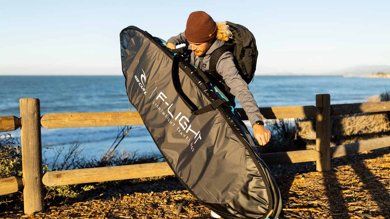 Conner Coffin and friend sitting on fence with Rip Curl F-Light Boardbags