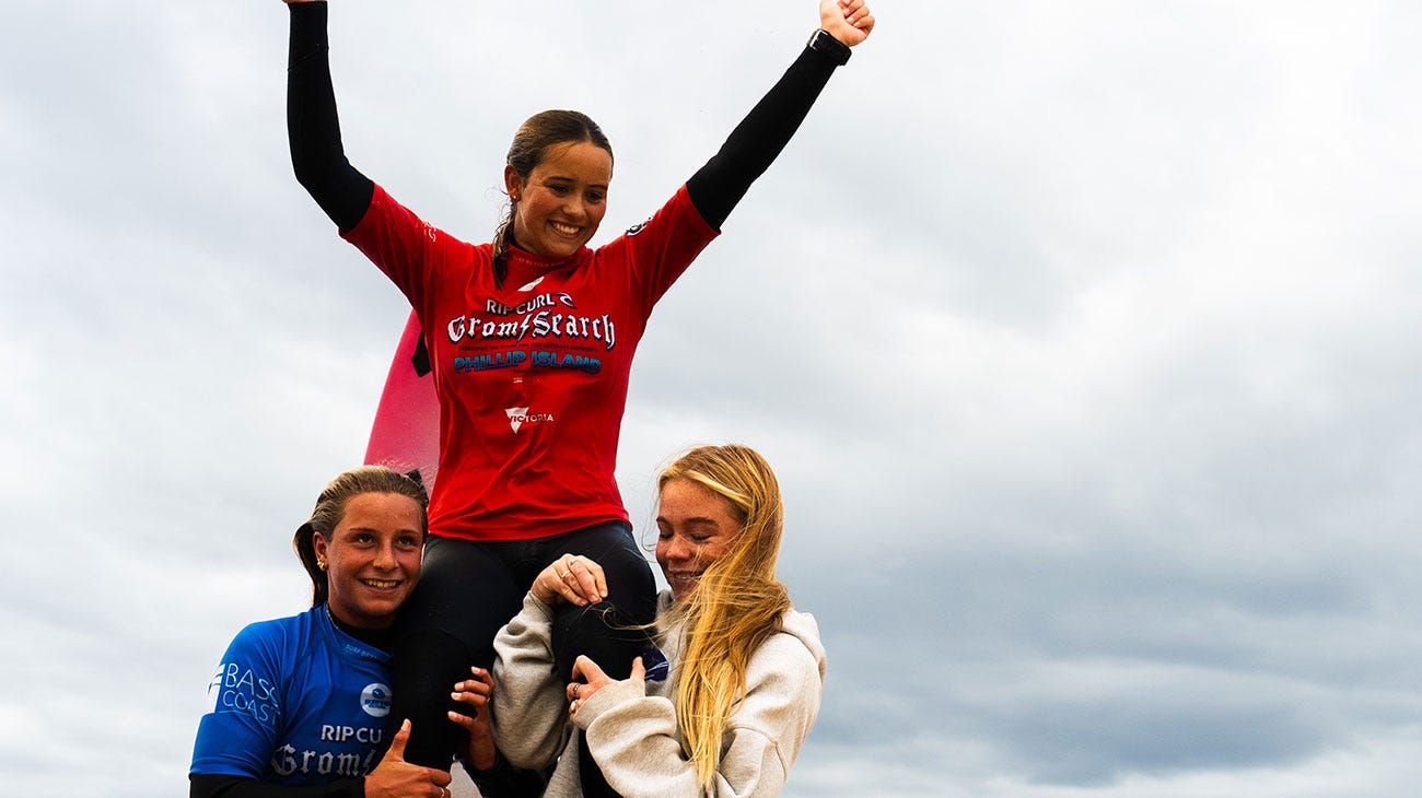 GromSearch winner getting chaired up the beach by friends