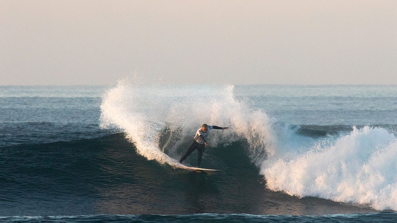 Contestant surfing in the Indigenous Surfing Titles