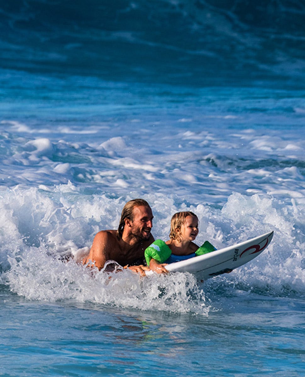 owen surfing with his kid