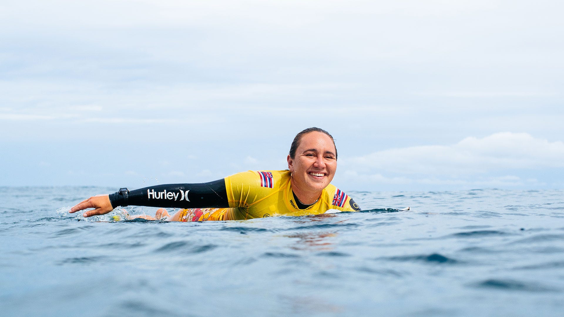 Carissa More surfing in his heat