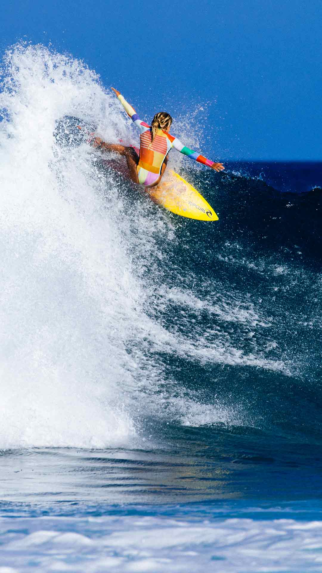 Rip Curl women surfing in Erin Miller Ray's surfsuit