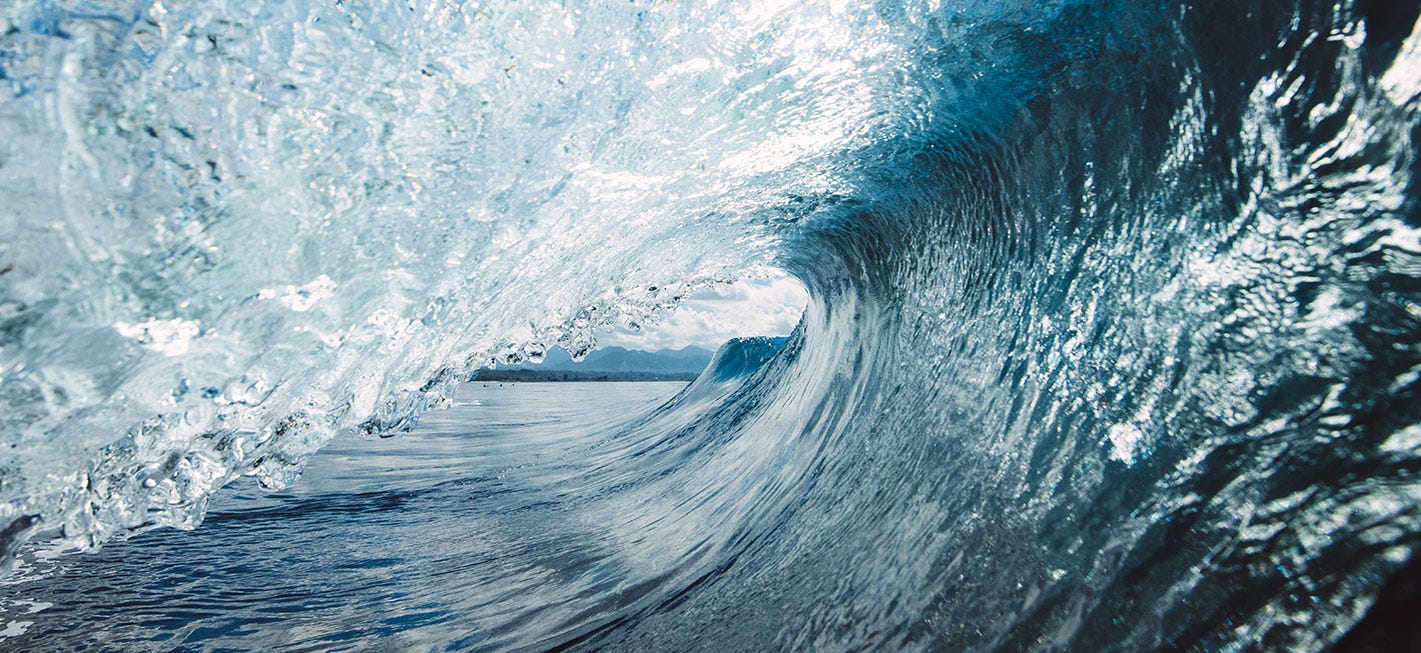 inside the barrel of a wave, looking down the length of the wave