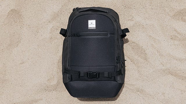 F-Light School Backpack flat laid in the sand