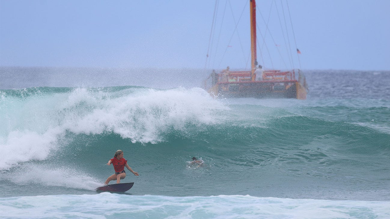 Under 14 girls champion surfing in her heat
