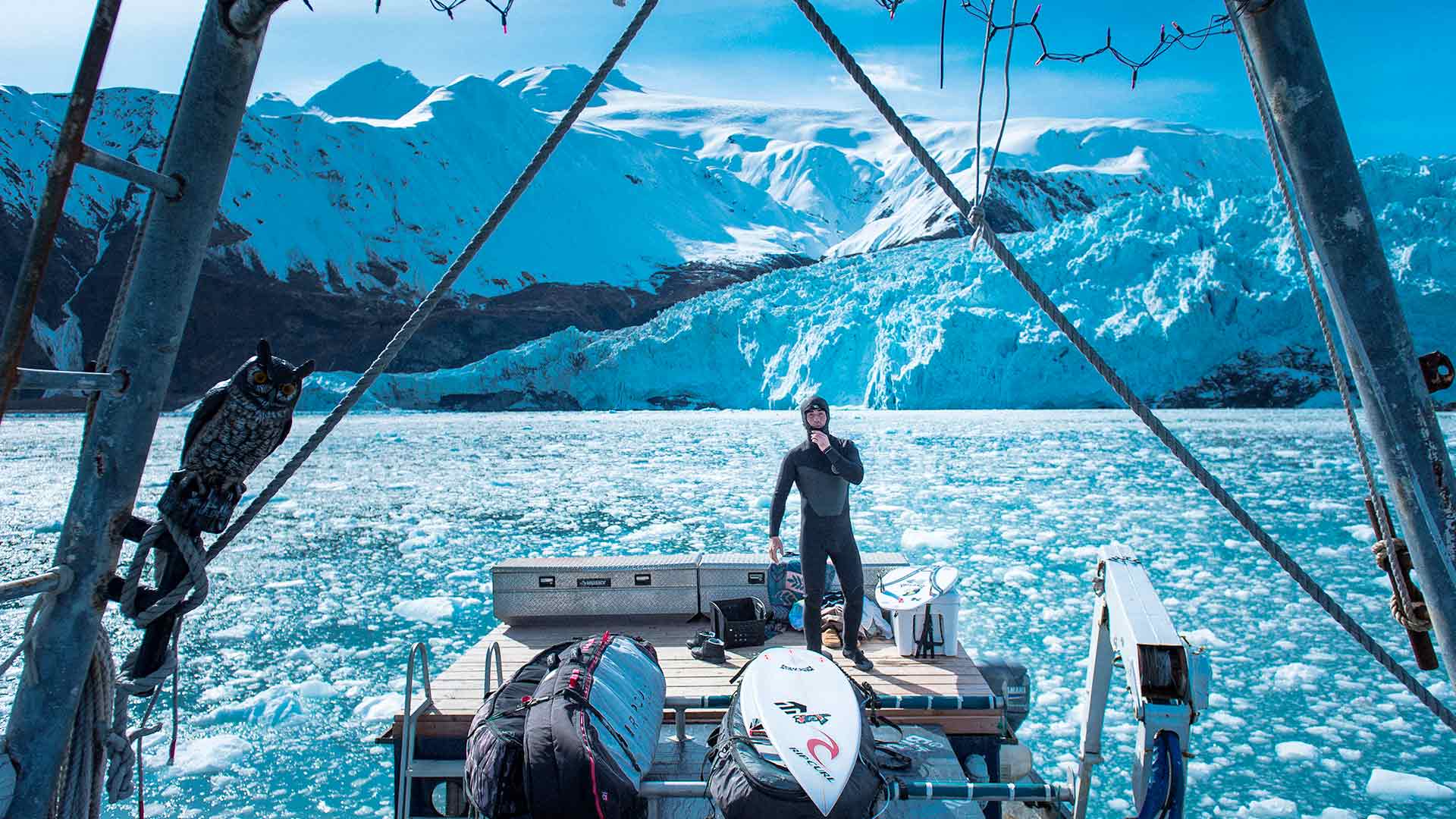 Mason Ho in a boat in Alaska infront of Glaciers