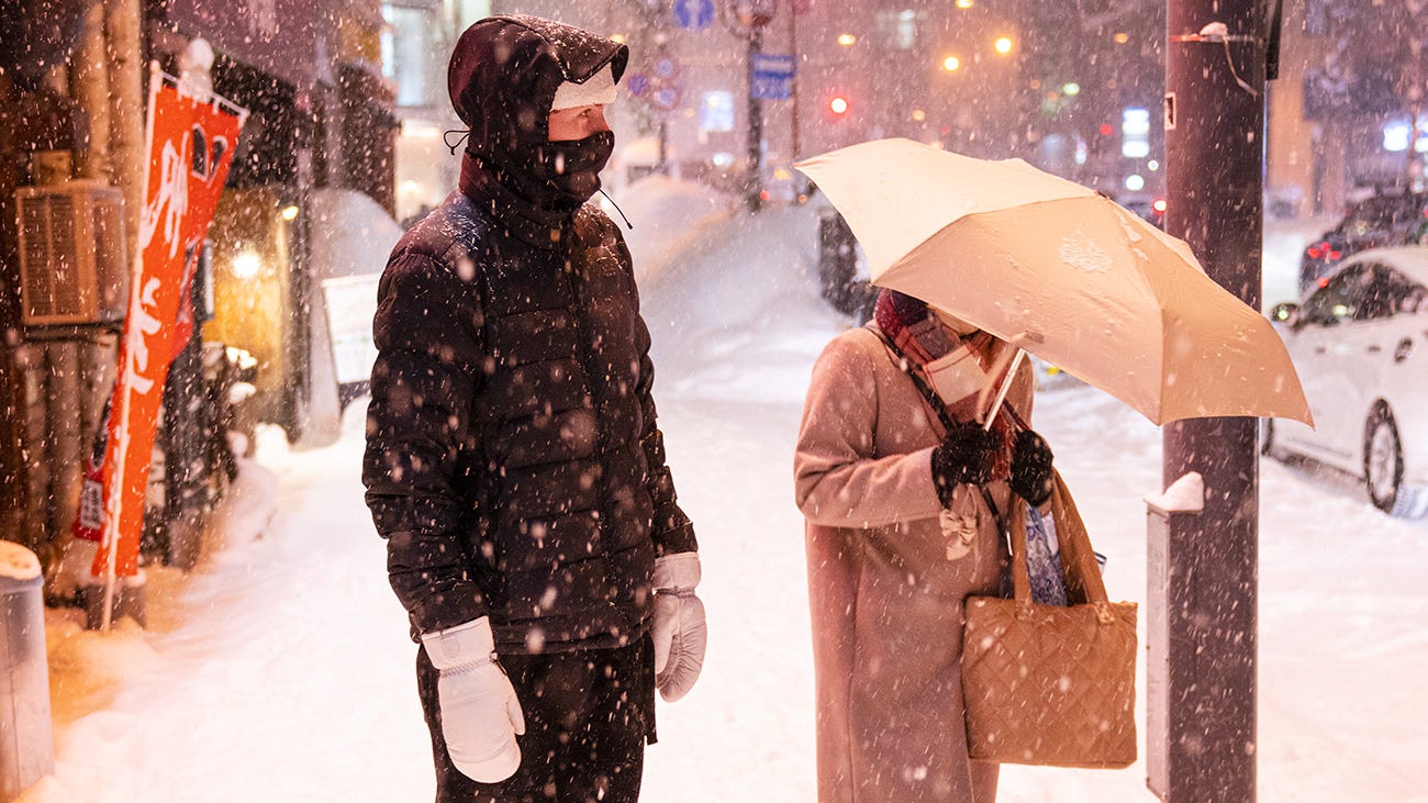 Rip Curl snowboarder in the snowy streets