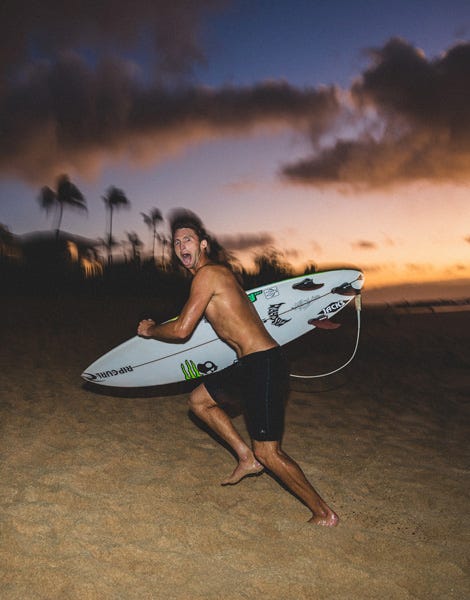 Crosby Colapinto runnign along the beach in Hawaii at sunset