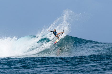 Erin Brooks surfing in Fiji