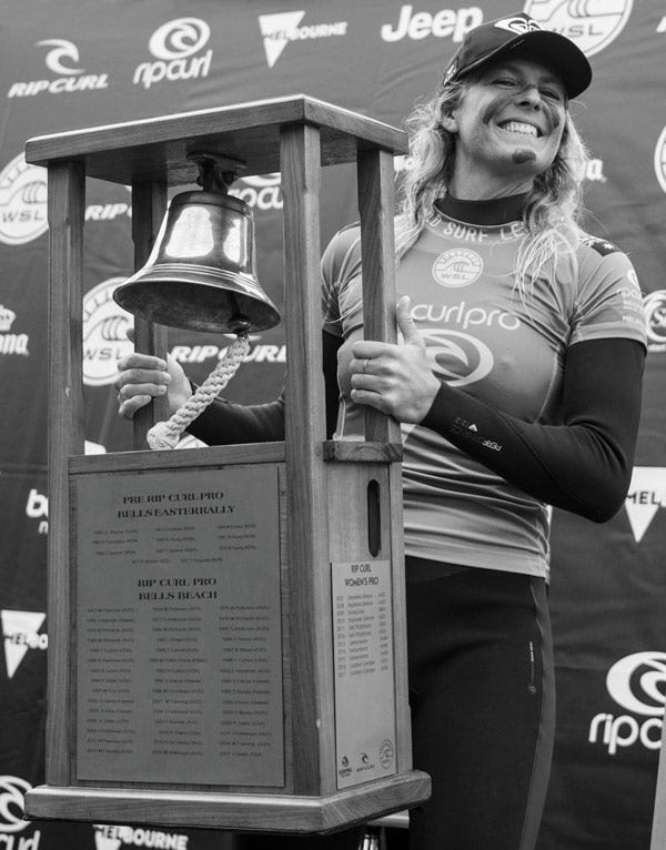 Stephanie Gilmore holding the Rip Curl Pro Bells Beach trophy