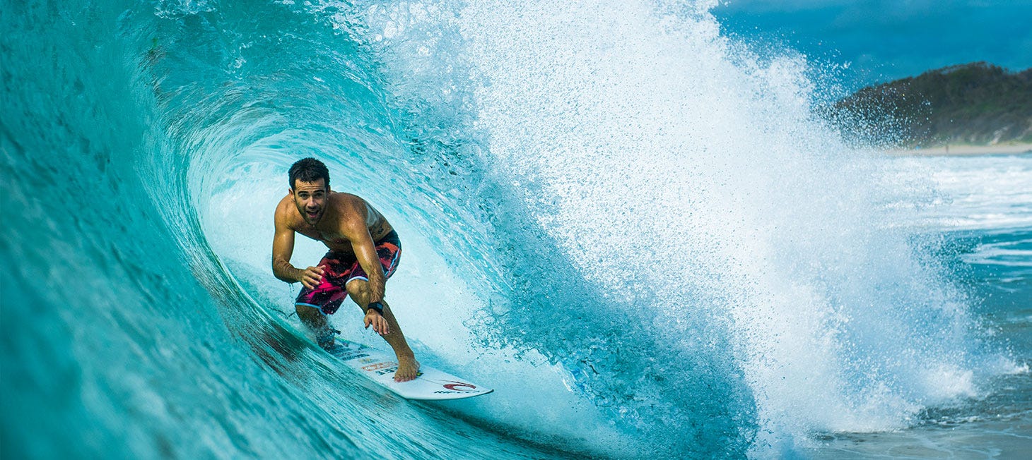 Mason Ho getting barrelled. Image links to video showing Mason surfing in Rip Curl's 3-2-one boardshorts