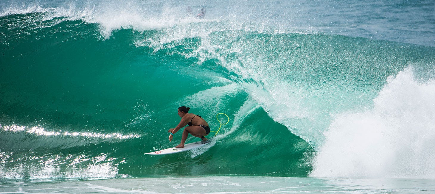 Tyler Wright riding a wave. Image links to video showing Tyler's two times winning world titles